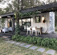 Absolute riverfront shipping container cabin - eAccommodation